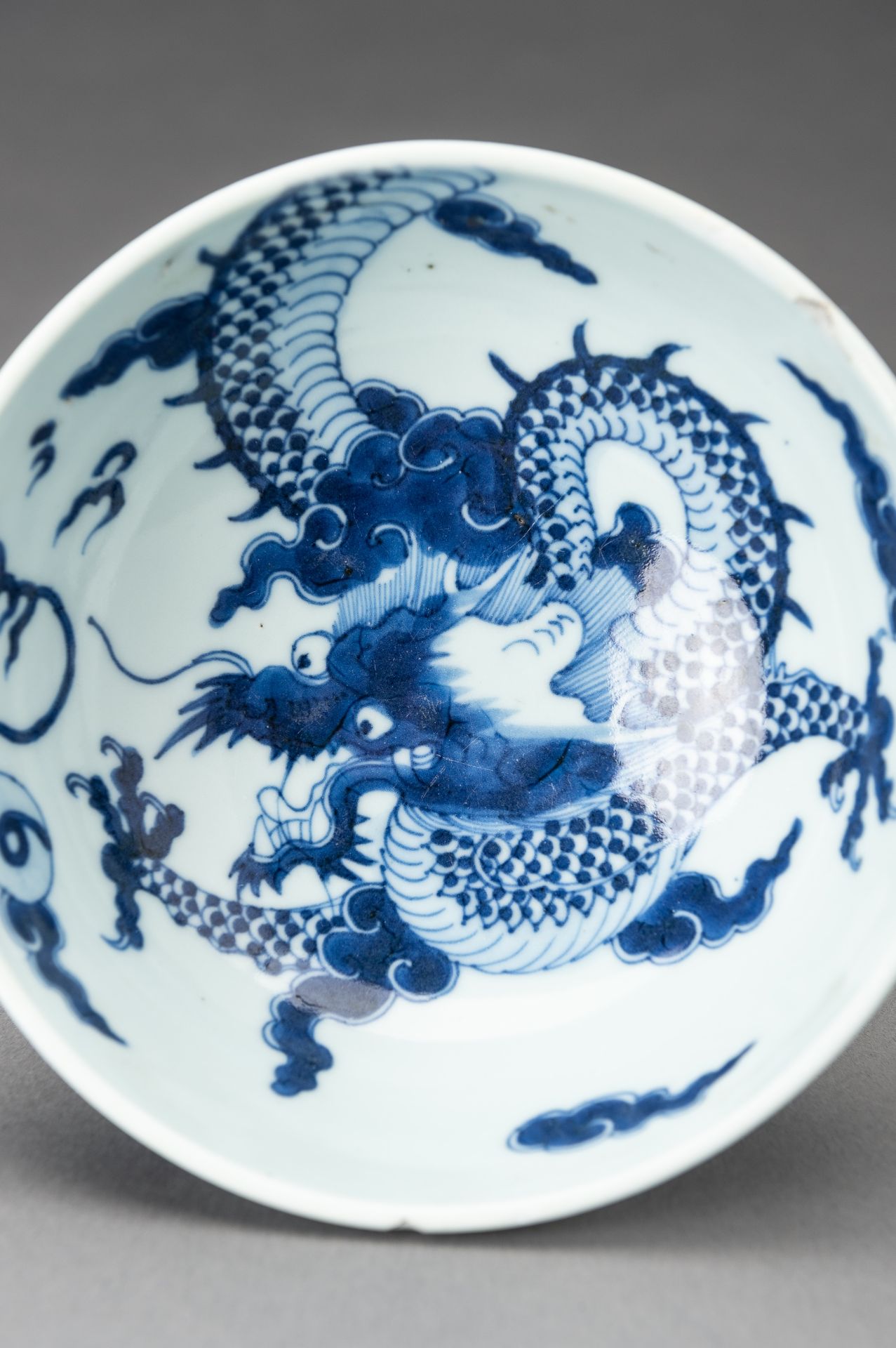 A BLUE AND WHITE 'DRAGON' PORCELAIN BOWL, 1920s - Image 9 of 14