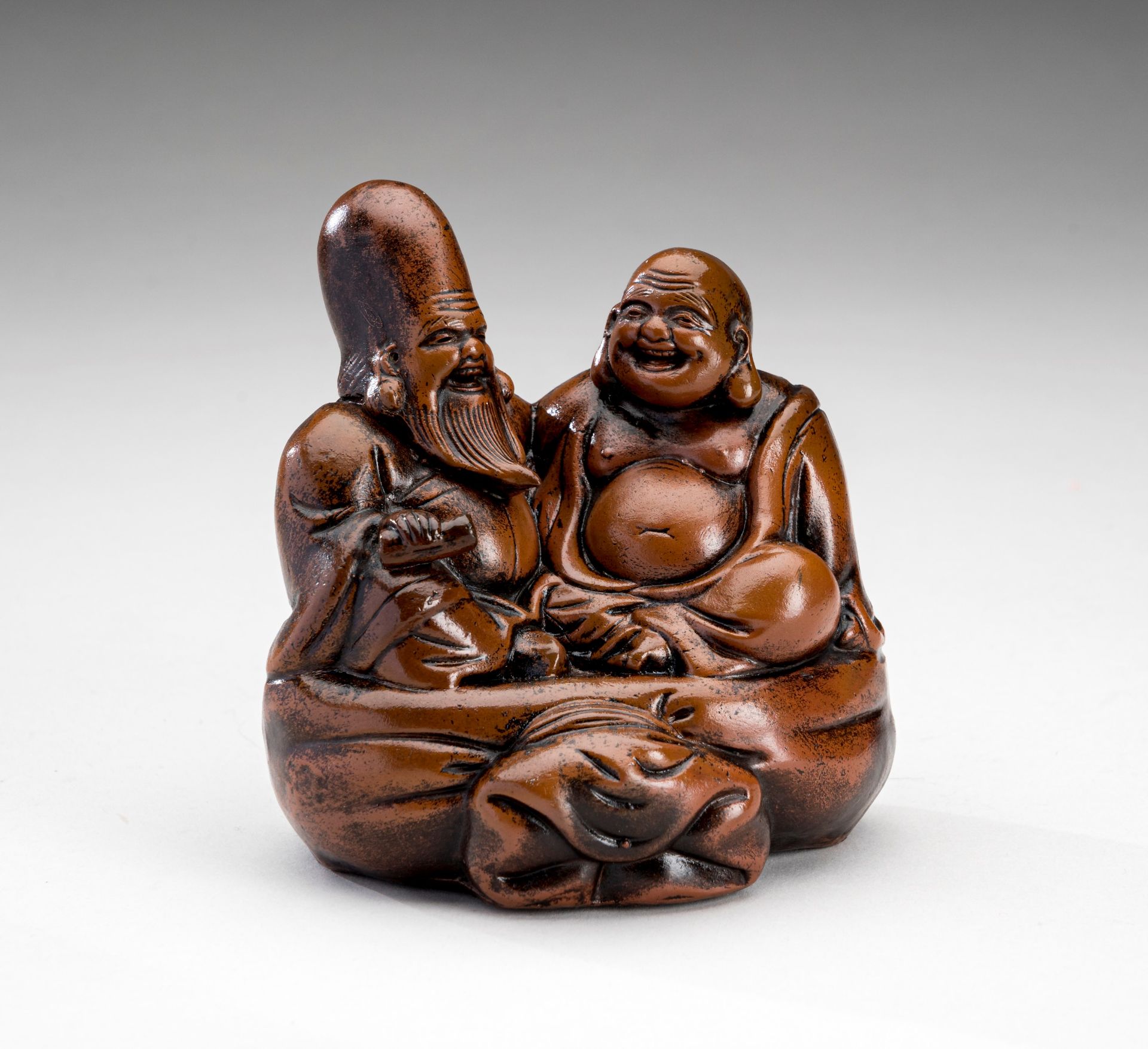 A PORCELAIN FIGURE OF FUKUROKUJU AND BUDAI, MEIJI