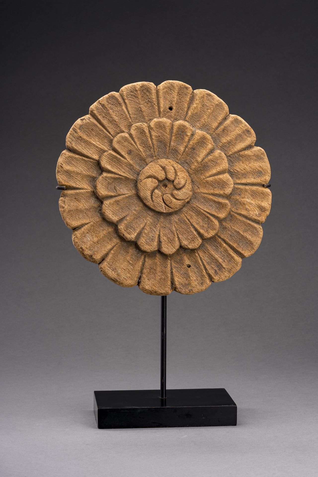 A CARVED WOOD BUDDHIST 'LOTUS' MEDALLION