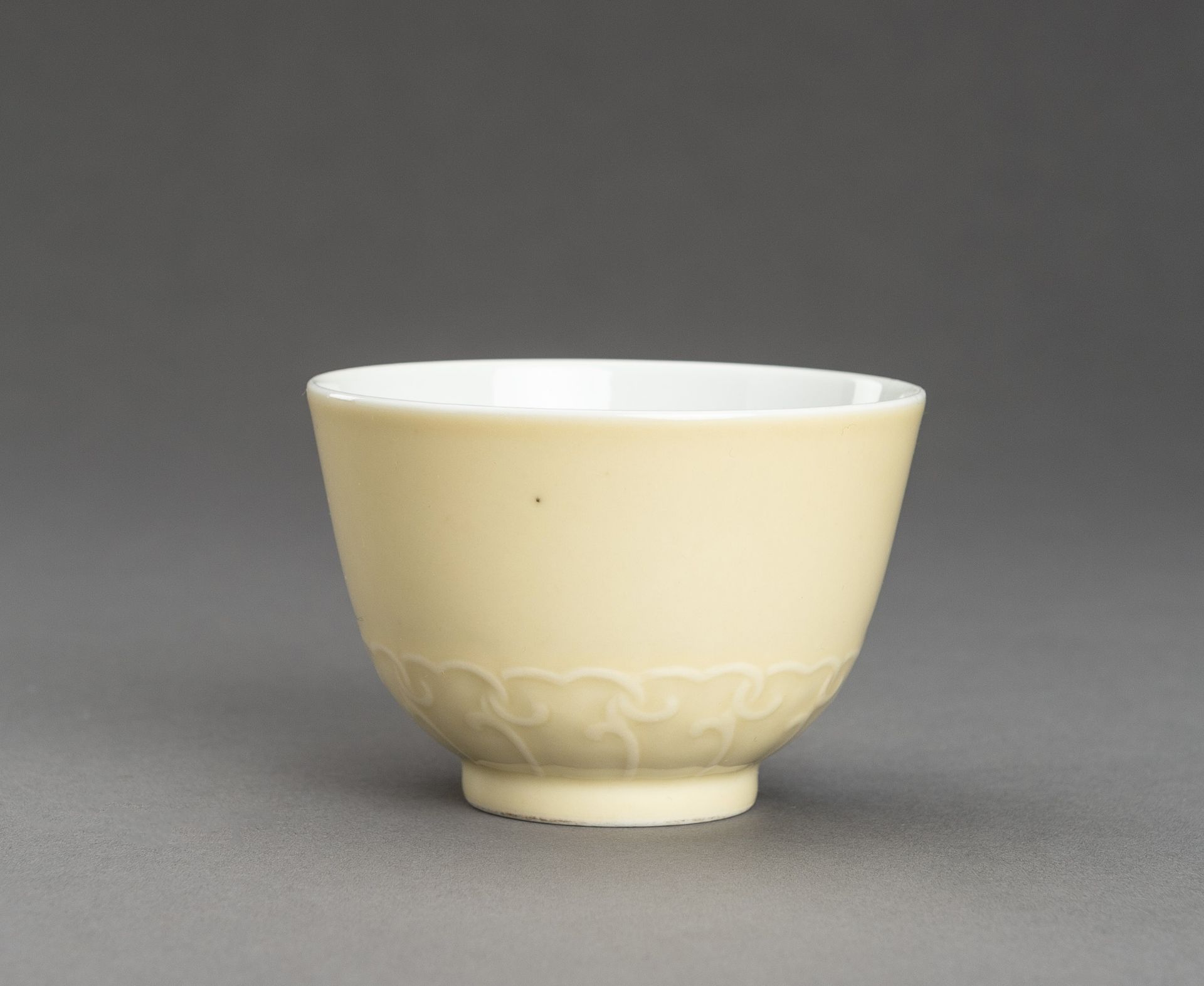 A CREAM GLAZED PORCELAIN CUP, YONGZHENG MARK