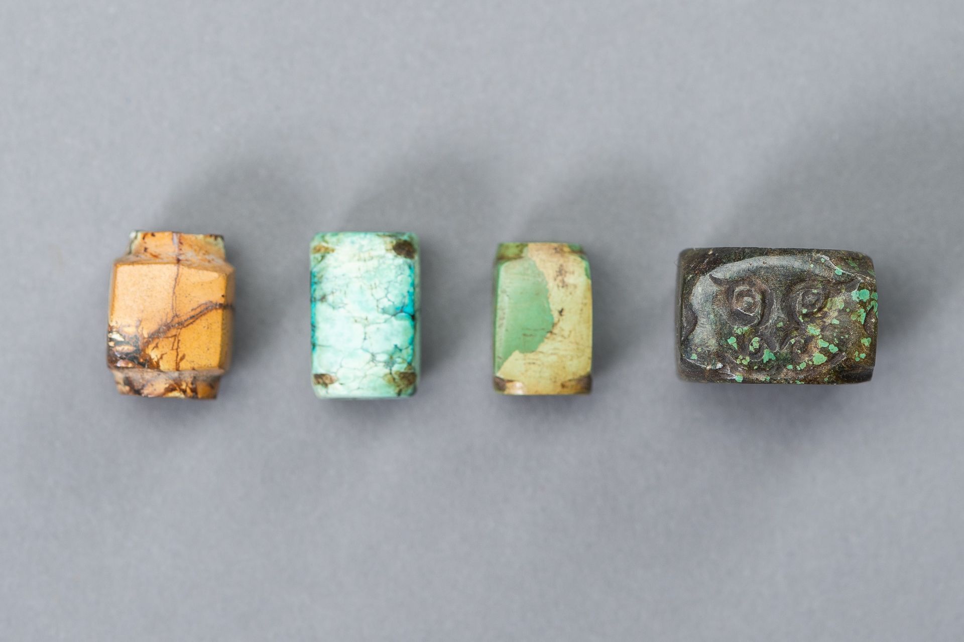 A SET OF FOUR MINIATURE CONG BEADS, MING DYNASTY