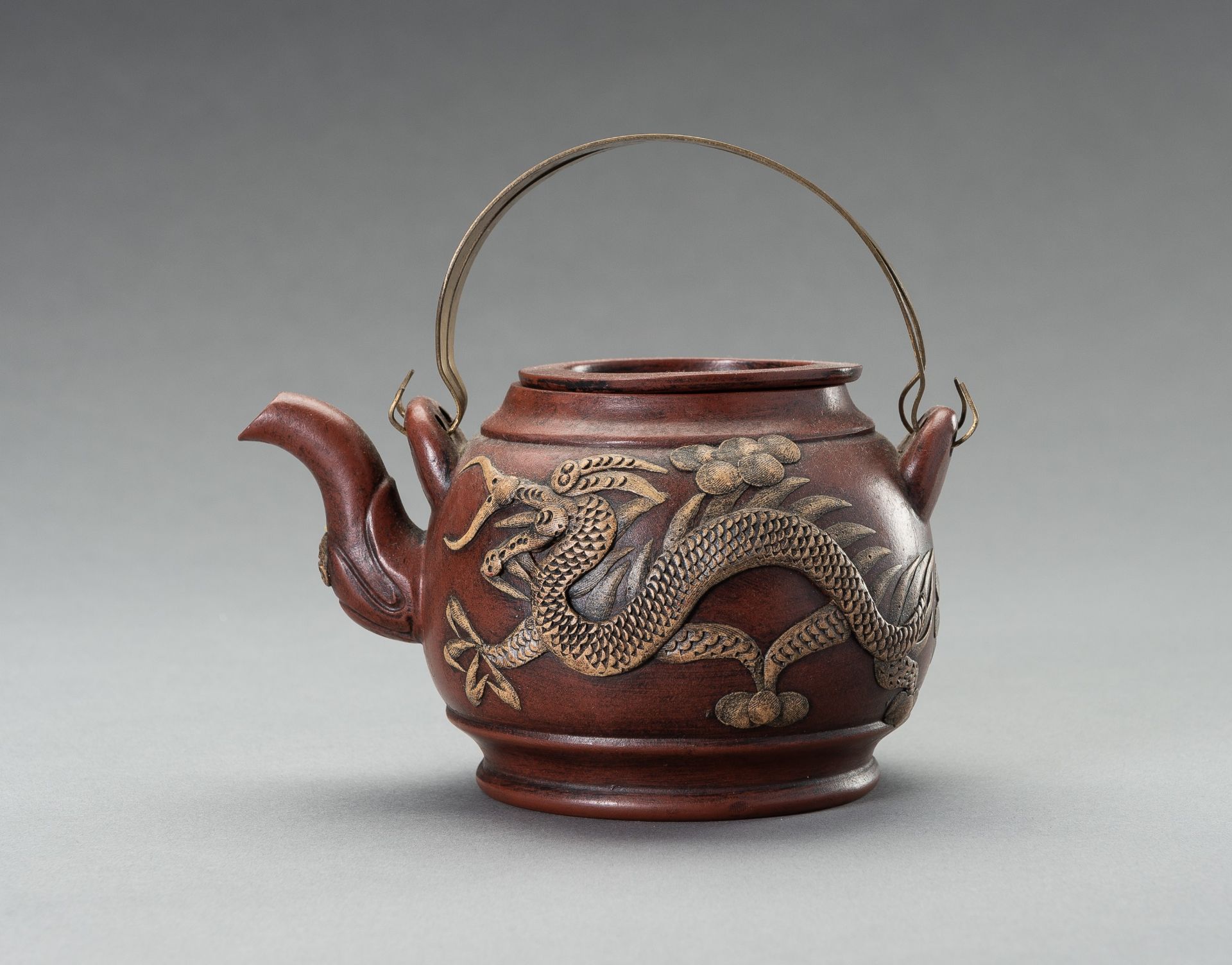 A ZISHA PORCELAIN TEAPOT WITH DRAGONS, REPUBLIC PERIOD