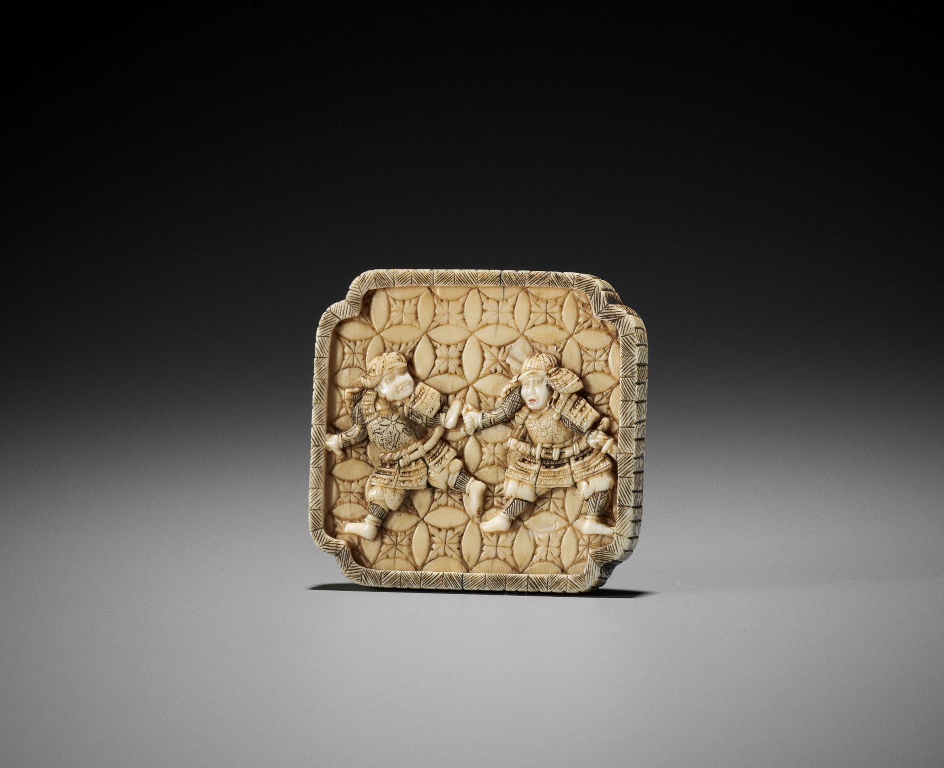 IKKO: A RARE IVORY MANJU NETSUKE WITH TWO SAMURAI