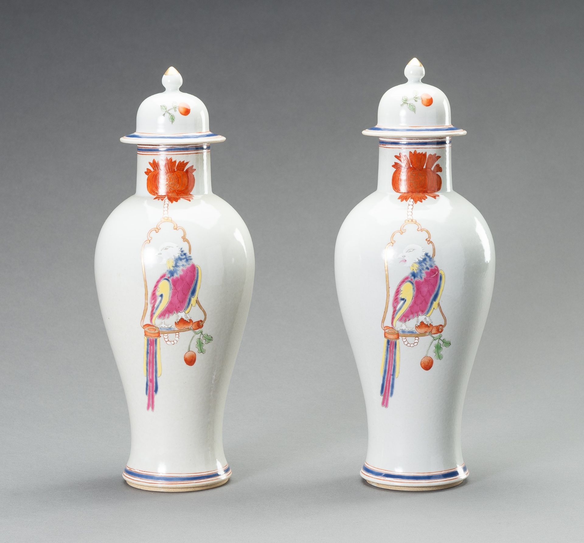 A PAIR OF FAMILLE ROSE 'PARROT ON PERCH' BALUSTER VASES, QING