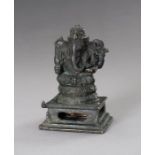 A BRONZE FIGURE OF GANESHA