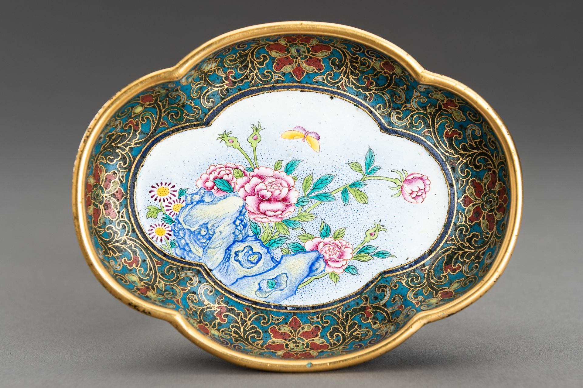 A LOBED CLOISONNE 'BUTTERFLY AND PEONIES' DISH, c. 1920s