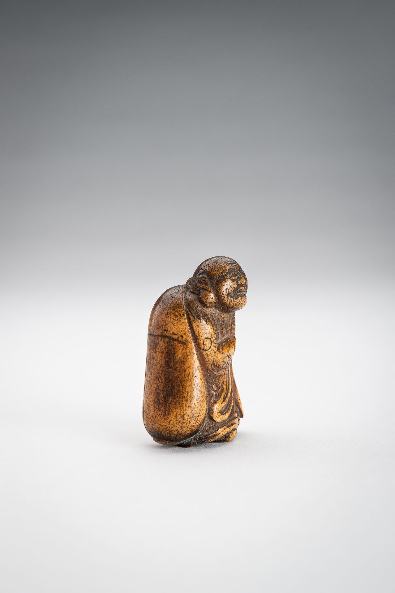 A STAG ANTLER NETSUKE OF HOTEI WITH HIS TREASURE BAG - Image 6 of 9