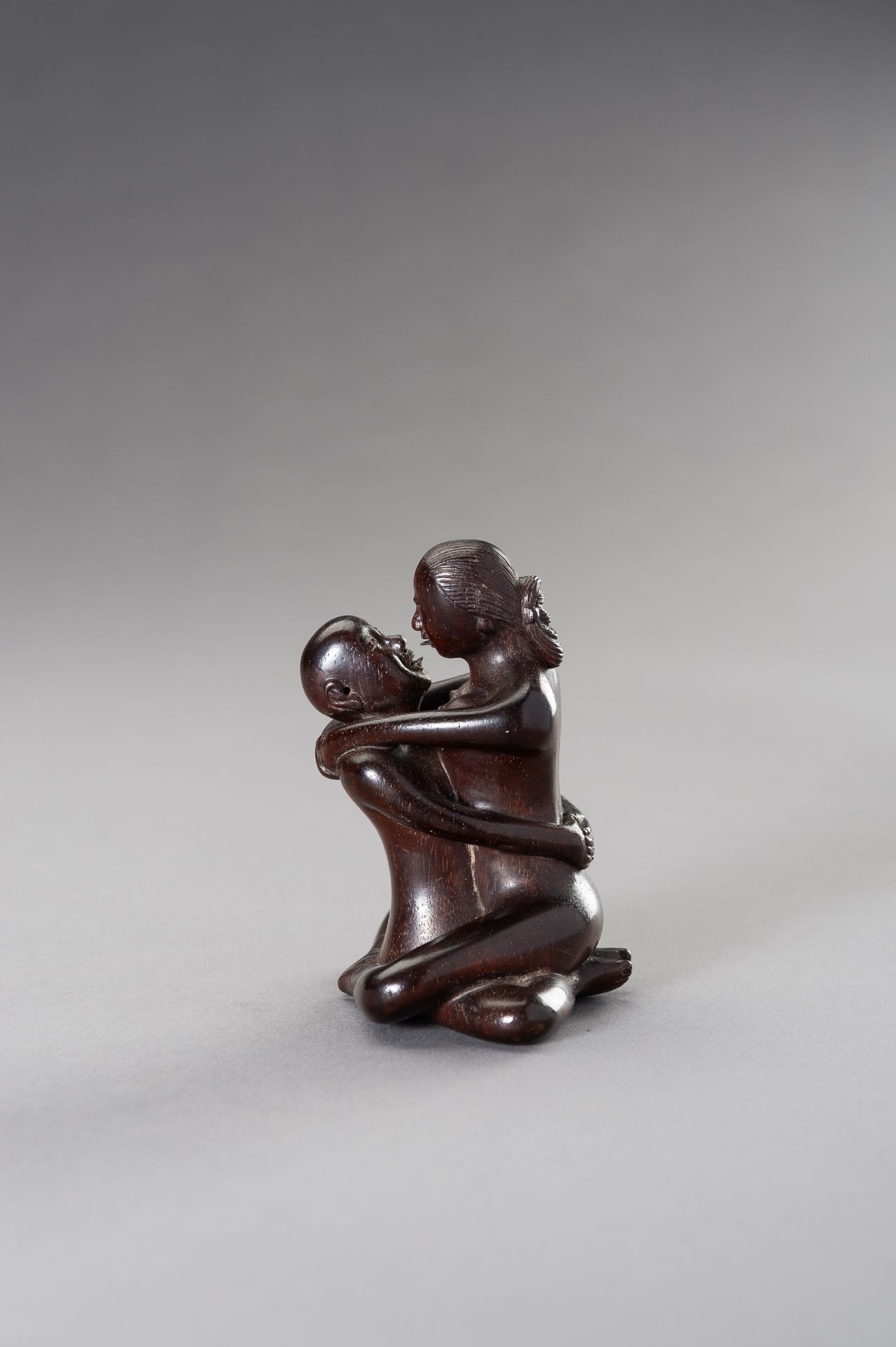 A ZITAN WOOD FIGURE OF A COUPLE IN EROTIC EMBRACE - Image 9 of 12