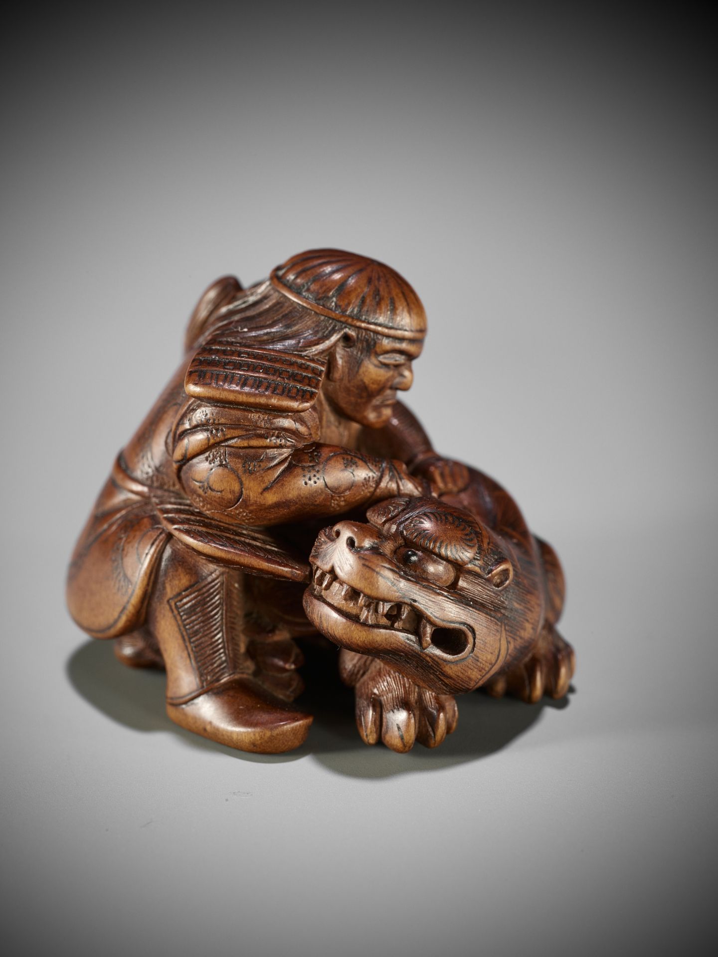 MASAKATA: A FINE AND RARE WOOD NETSUKE OF HADESU SLAYING THE TIGER - Image 2 of 17