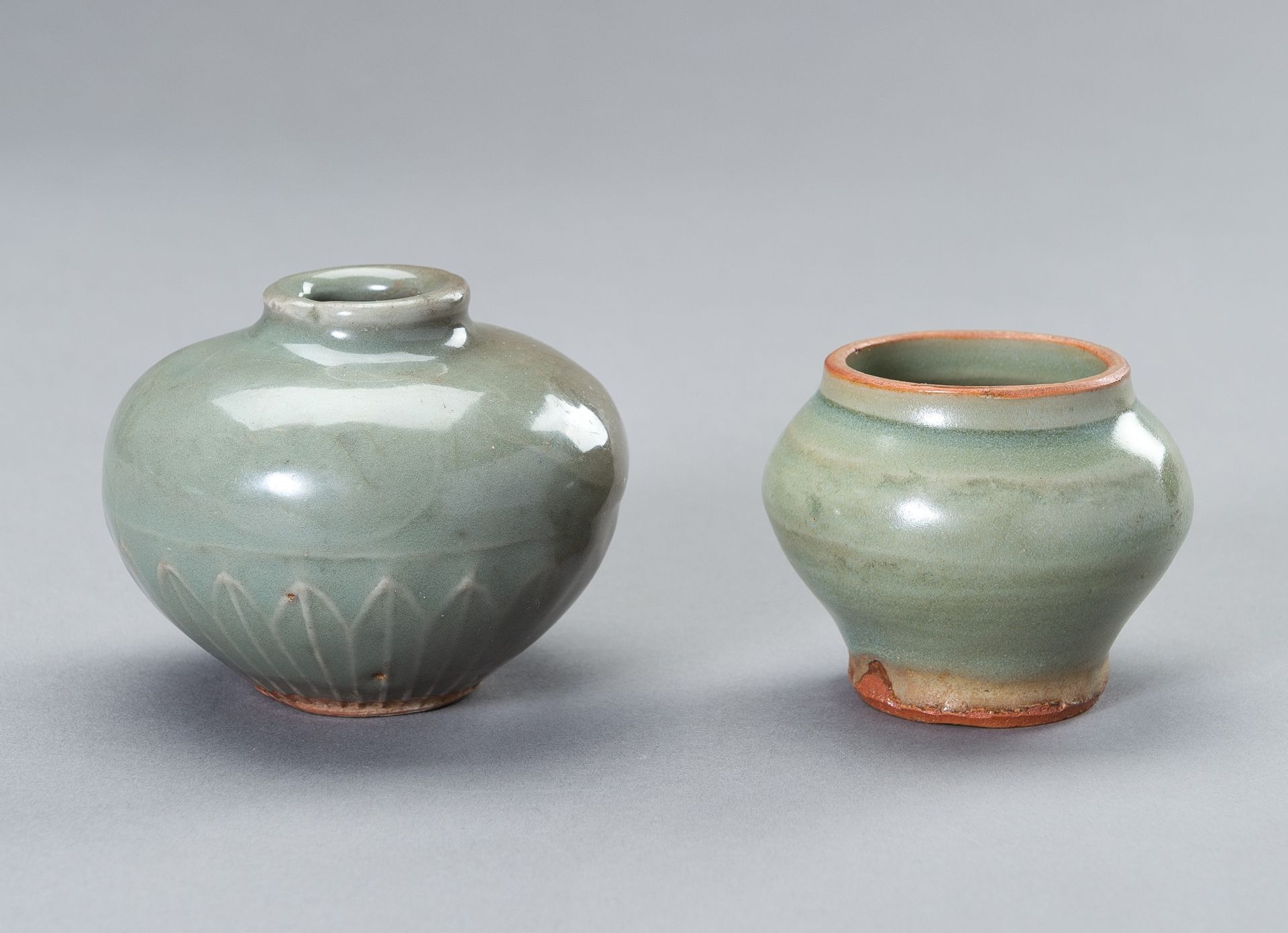 TWO SMALL CELADON GLAZED JARS