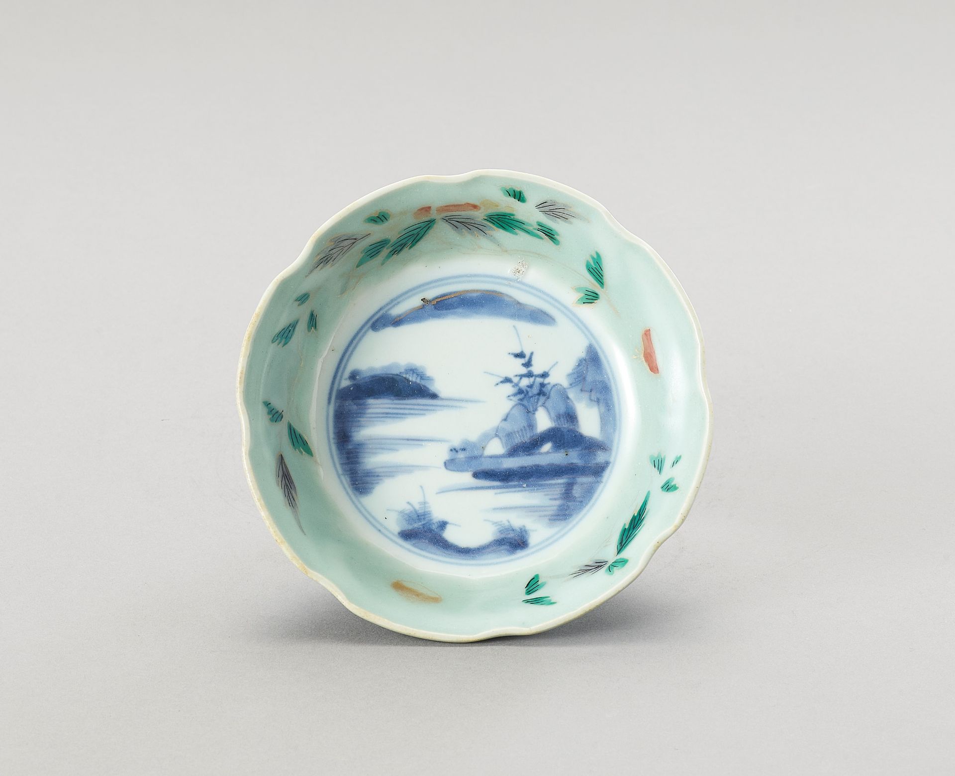 A LOBED POLYCHROME PORCELAIN BOWL