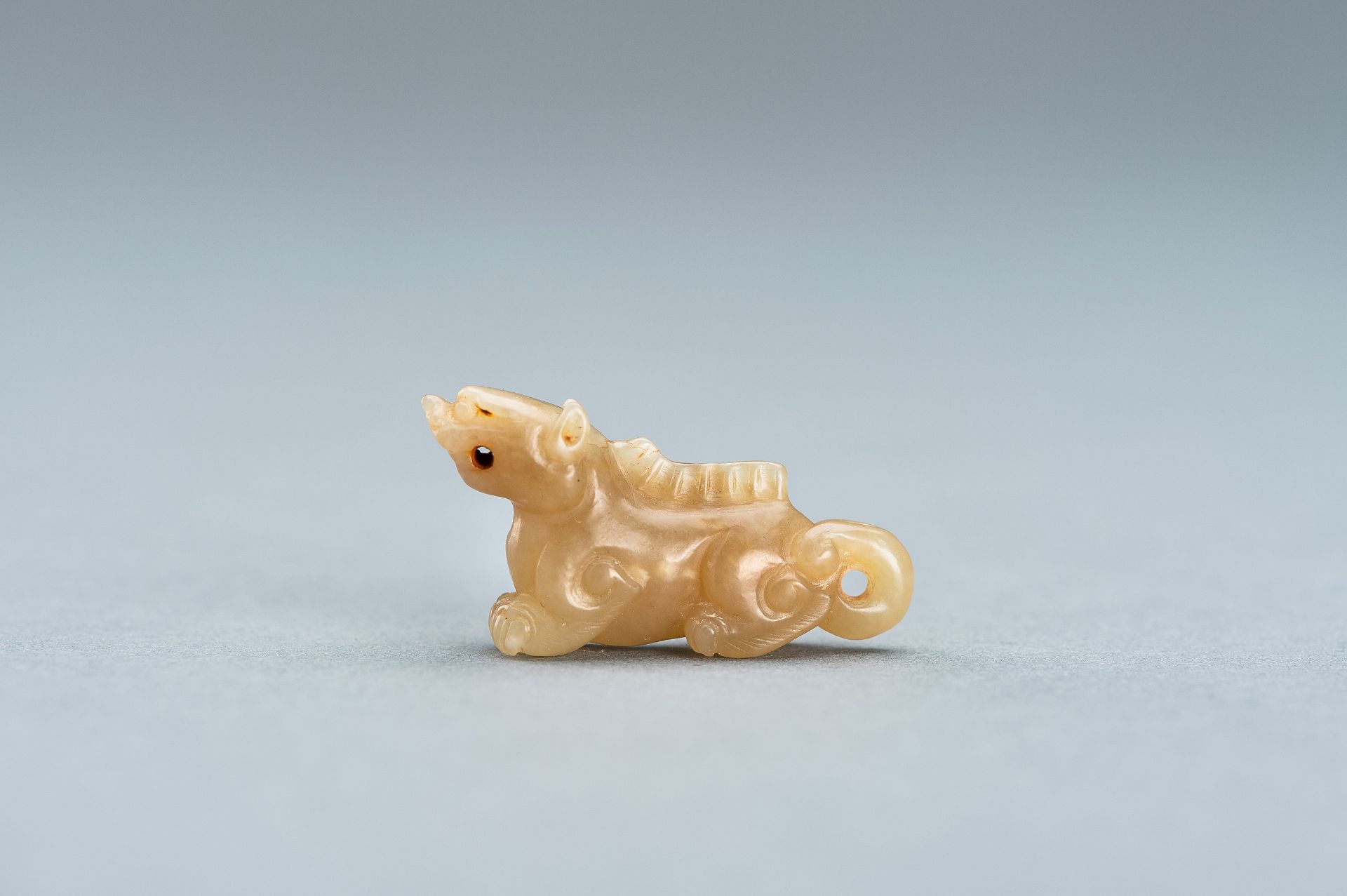 A PALE GREEN MINIATURE CARVING OF A LION, c. 1920s - Image 10 of 13