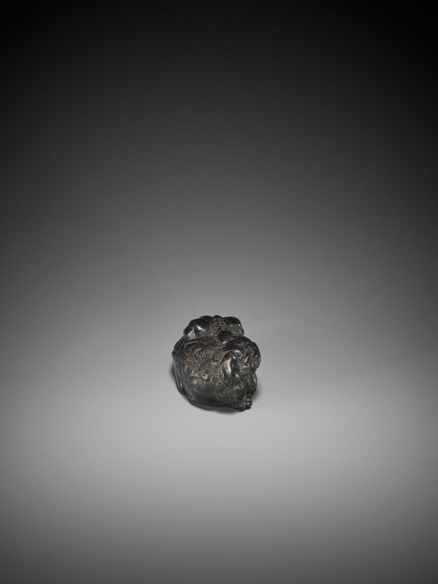 KOKEI: A RARE EBONY WOOD NETSUKE OF A SHISHI SCRATCHING HIS EAR - Image 7 of 10