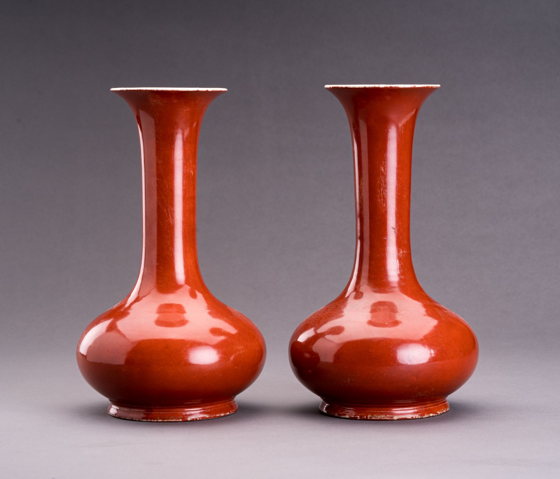 A PAIR OF A COPPER-RED PORCELAIN BOTTLE VASES