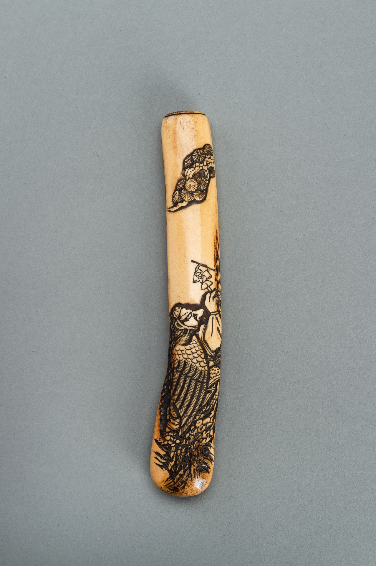 A STAG ANTLER KISERUZUTSU OF TENGU AND ISSUN BOSHI