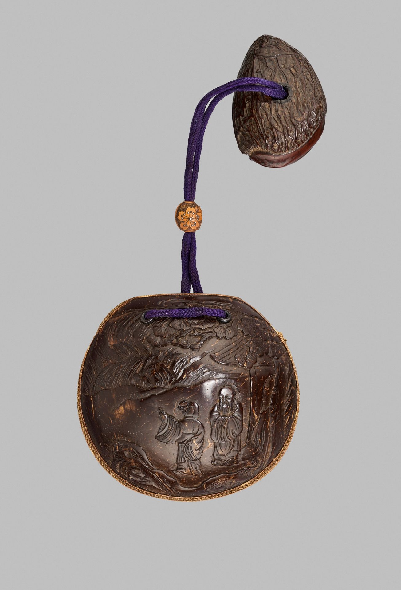 A RARE COCONUT AND LEATHER KINCHAKU (POUCH) WITH A FINE OJIME BY KOZAN AND EN SUITE NETSUKE