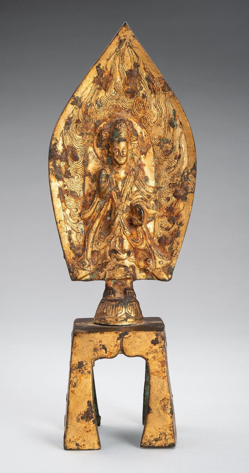 A GILT-BRONZE WEI-STYLE FIGURE OF MAITREYA, QING