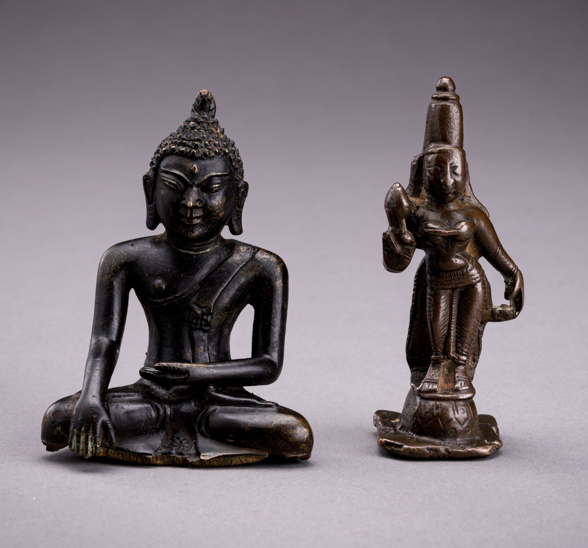 TWO INDIAN MINIATURE BRONZE FIGURES OF BUDDHA AND DEVI