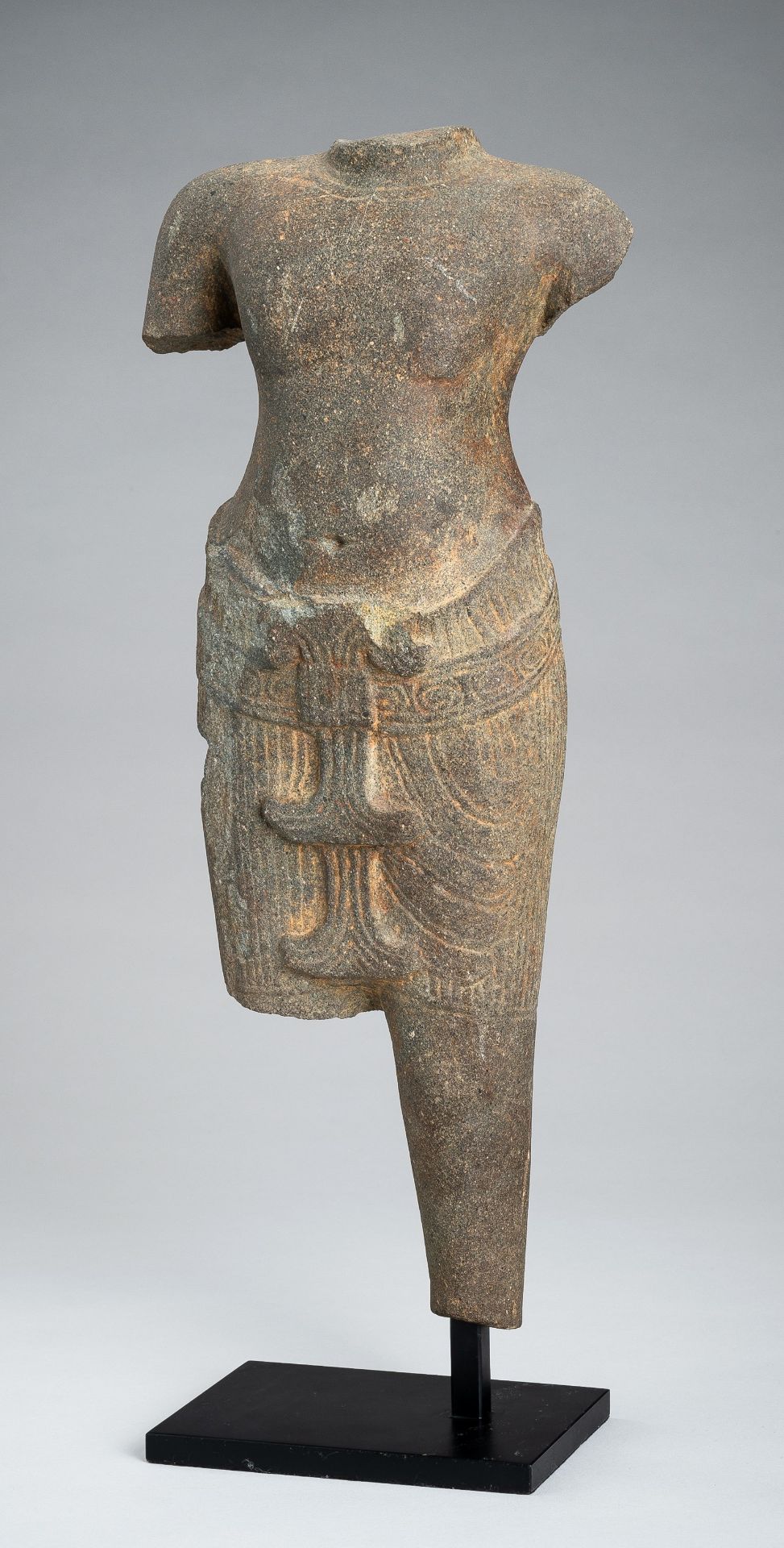 A KHMER ANGKOR WAT STYLE SANDSTONE TORSO OF A MALE DEITY