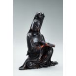 A BUFFALO HORN FIGURE OF GUANYIN