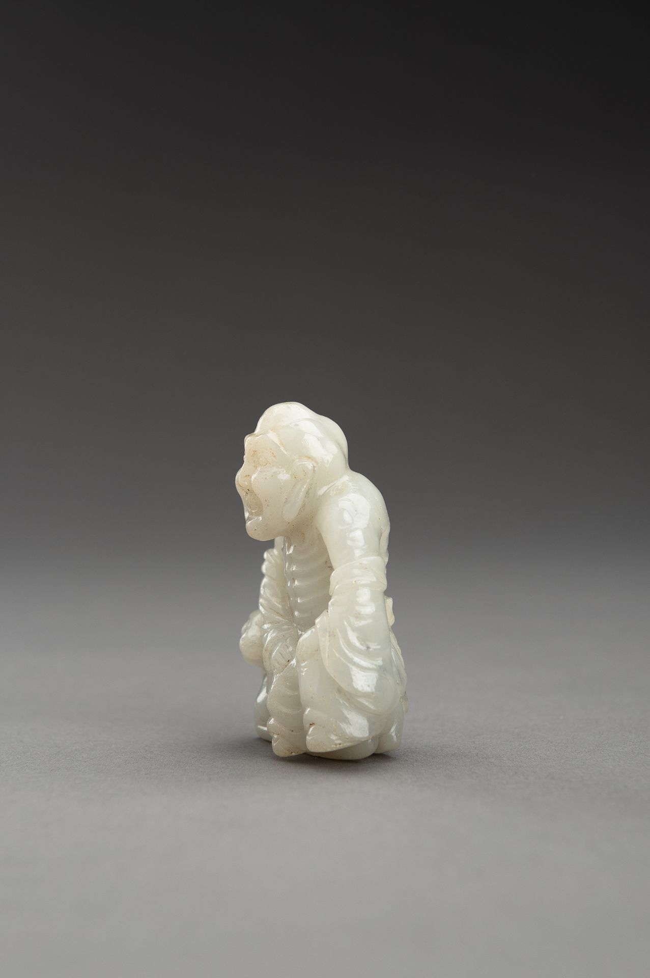 A WHITE JADE GROUP OF A LUOHAN AND DEER - Image 7 of 10