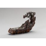 A CHENGXIANGMU ALOESWOOD CARVING OF A SAGE ON A RAFT, QING DYNASTY