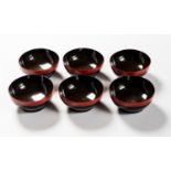 SIX RED AND BLACK LACQUERED BOWLS