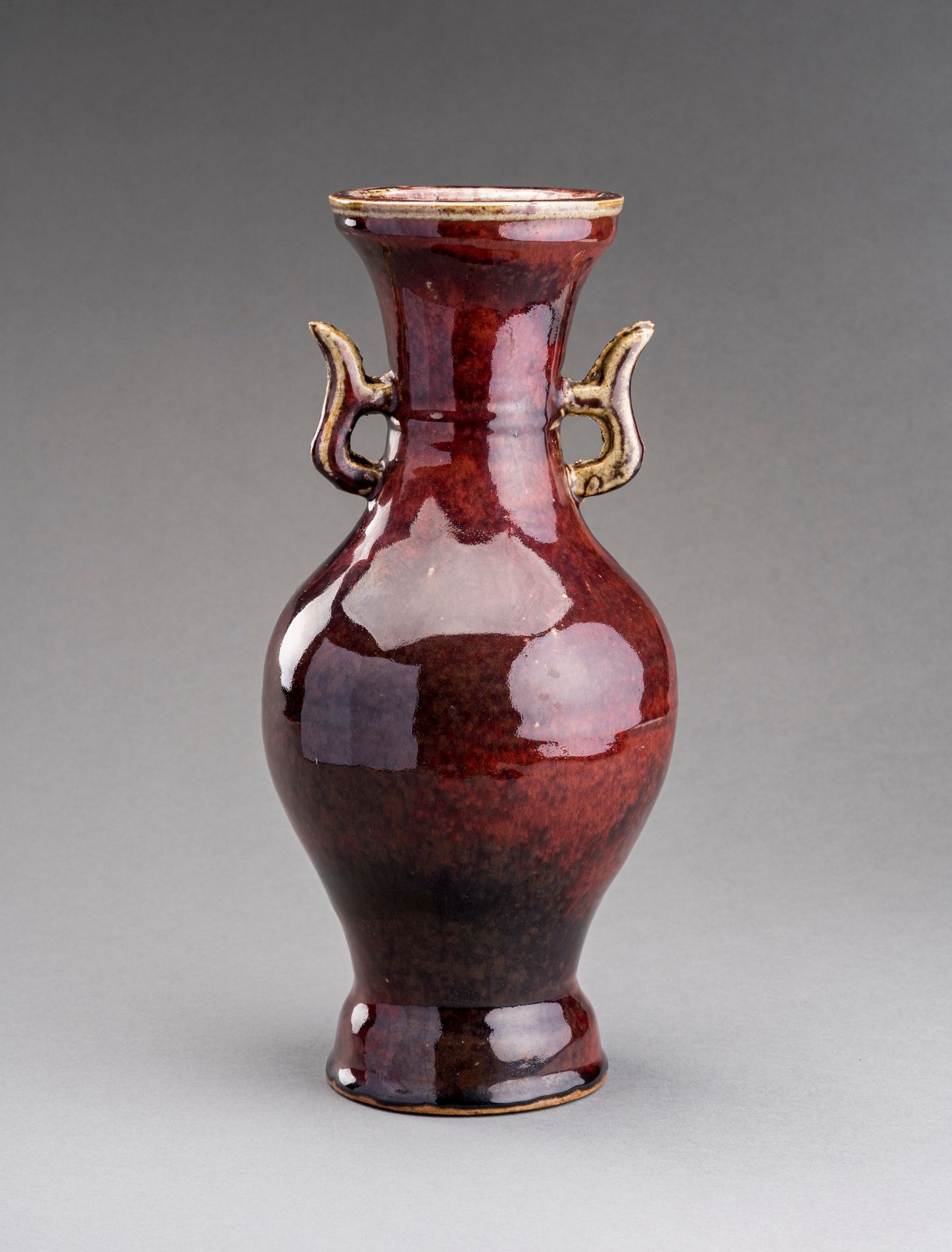 A RUBY-RED GLAZED SHIWAN CERAMIC VASE, QING DYNASTY