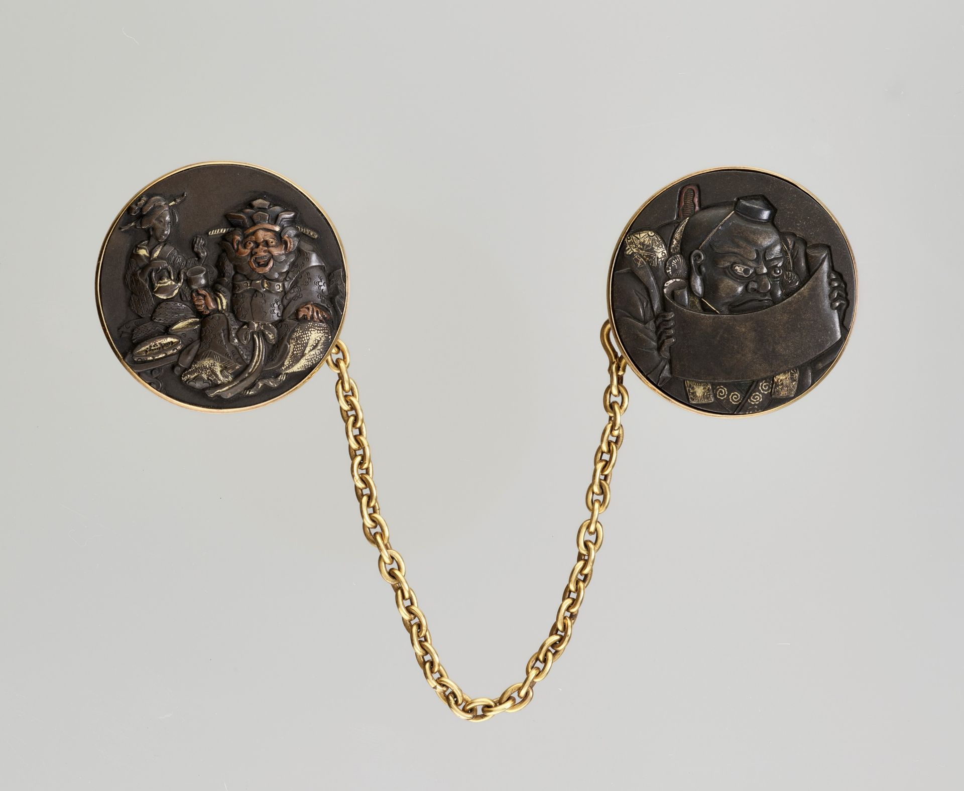 A PAIR OF FINE KANAMONO (POUCH FITTINGS) DEPICTING EMMA-O AND BENKEI