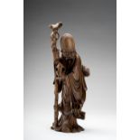 A CARVED WOOD FIGURE OF SHOULAO, c. 1900s