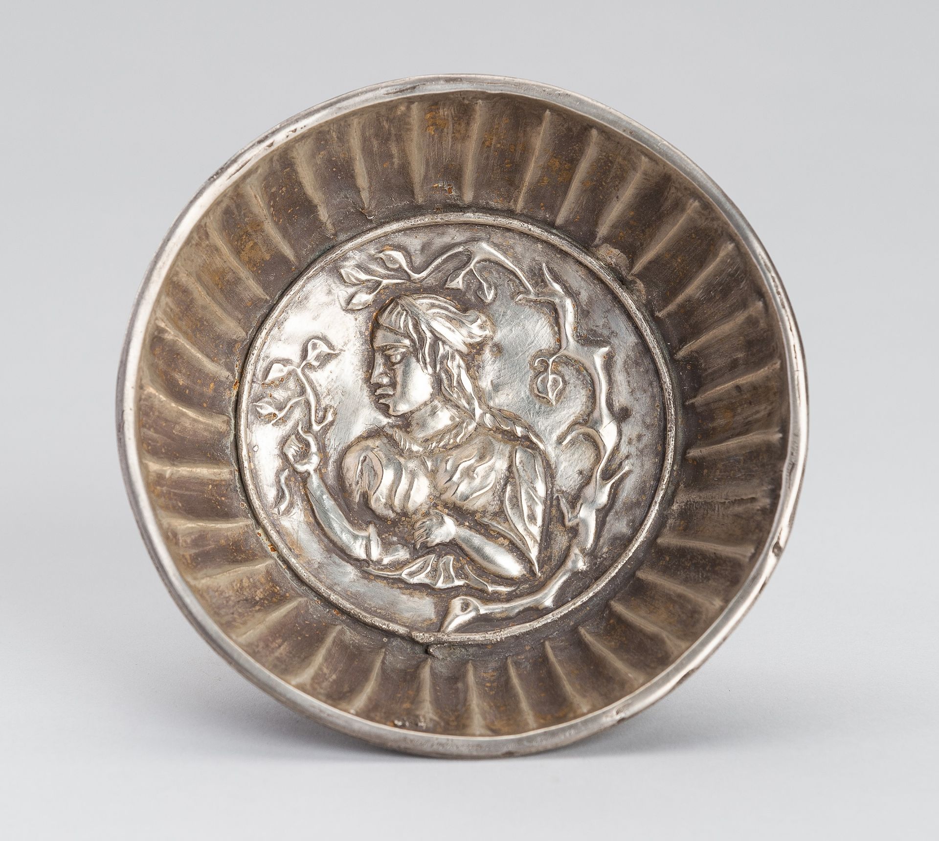 A GHANDARAN SILVER REPOUSSE BOWL WITH FEMALE FIGURE