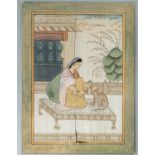 A LARGE INDIAN SILK PAINTING OF A NOBLEWOMAN WITH CAT