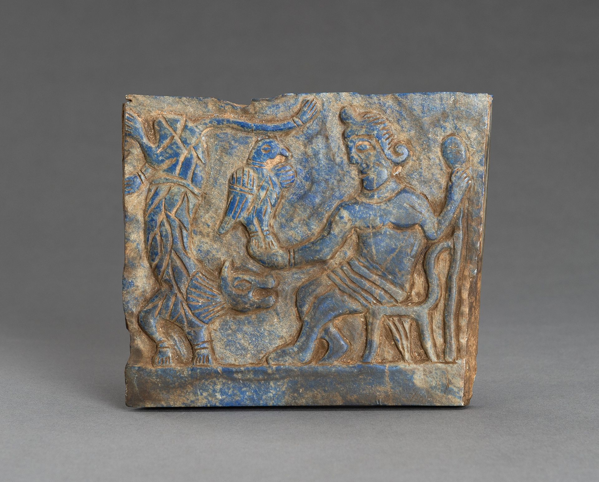 A LAPIS LAZULI FRIEZE OF A DIGNITARY WITH TIGER