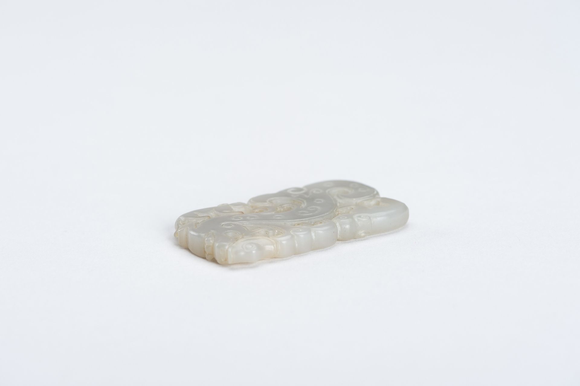 A CELADON-WHITE JADE 'DRAGON AND TAPIR' PENDANT, QING DYNASTY - Image 6 of 7