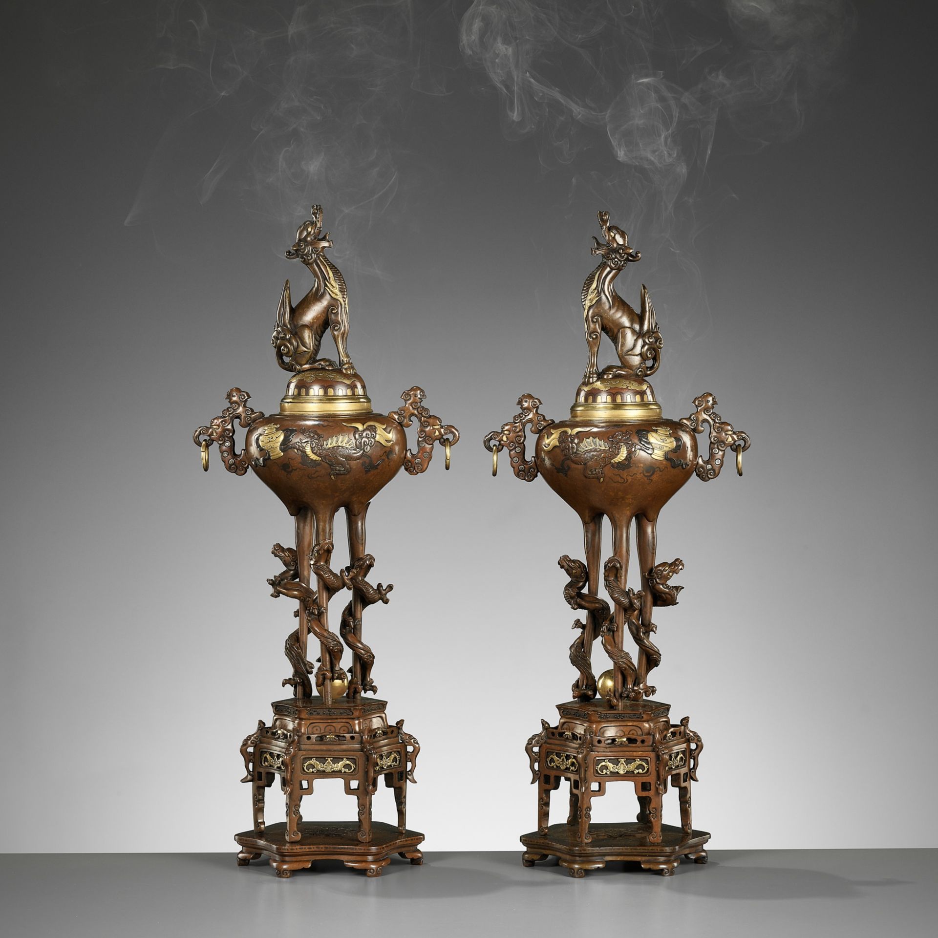 A PAIR OF SUPERB GOLD-INLAID BRONZE 'MYTHICAL BEASTS' KORO (INCENSE BURNERS) AND COVERS