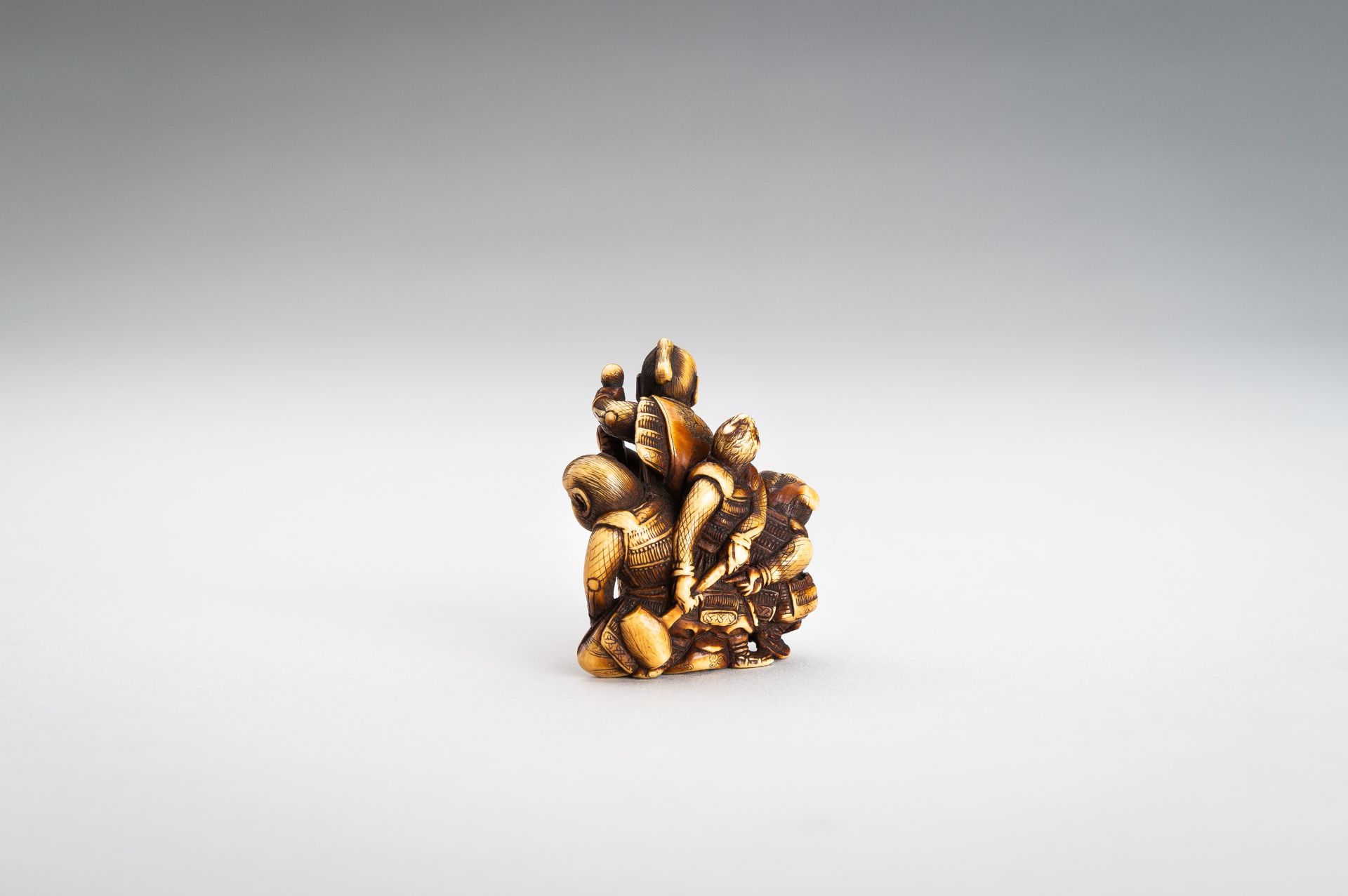 TOMOCHIKA: AN IVORY NETSUKE OF MOMOTARO WITH COMPANIONS - Image 7 of 11