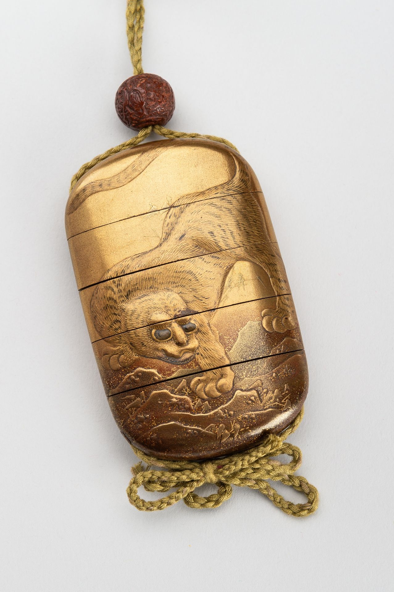 A GOLD-LACQUER FOUR-CASE INRO DEPICTING A TIGER AND A DRAGON, 19th CENTURY