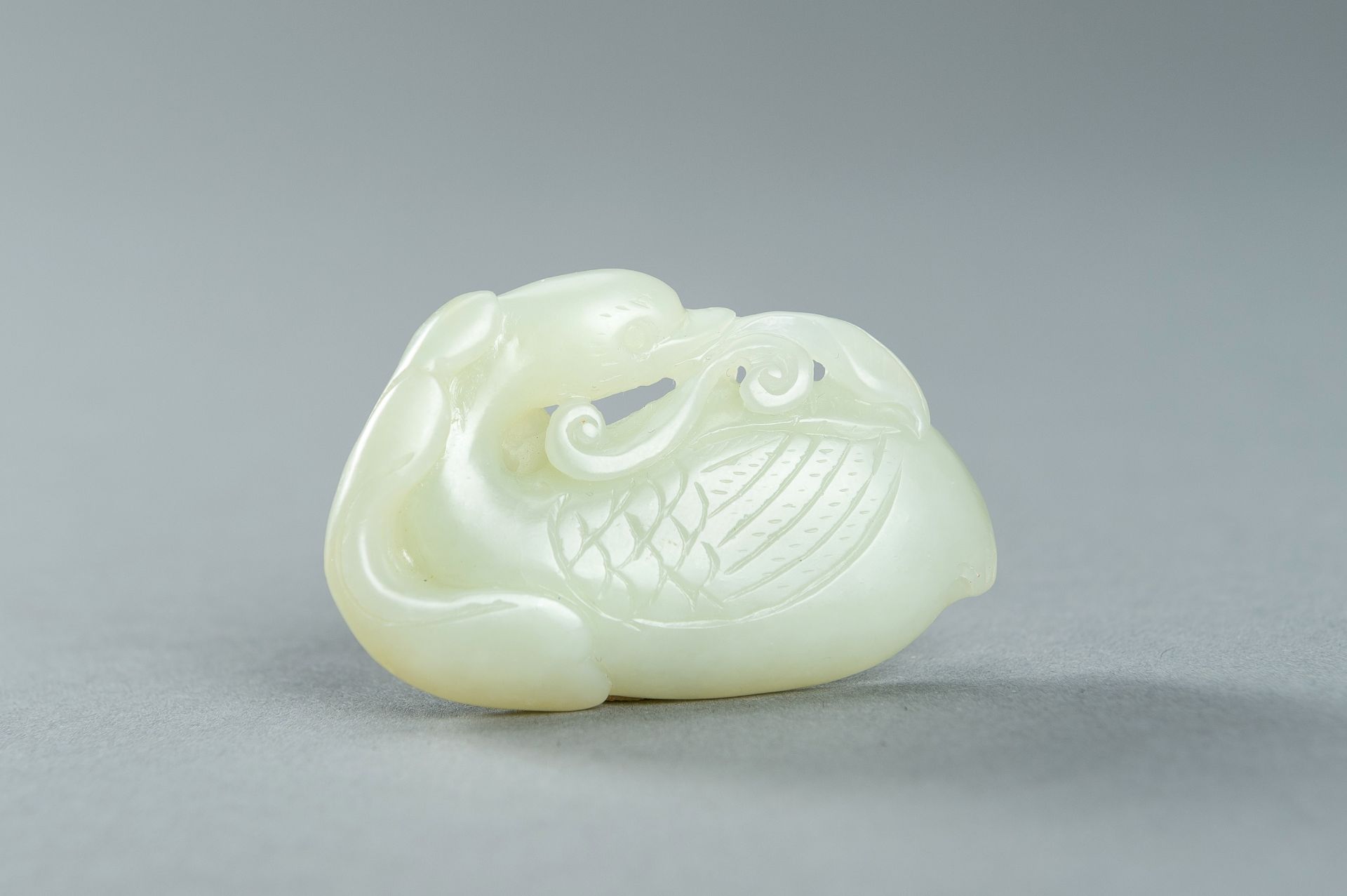 A PALE CELADON JADE CARVING OF A DUCK, 1900s - Image 12 of 13