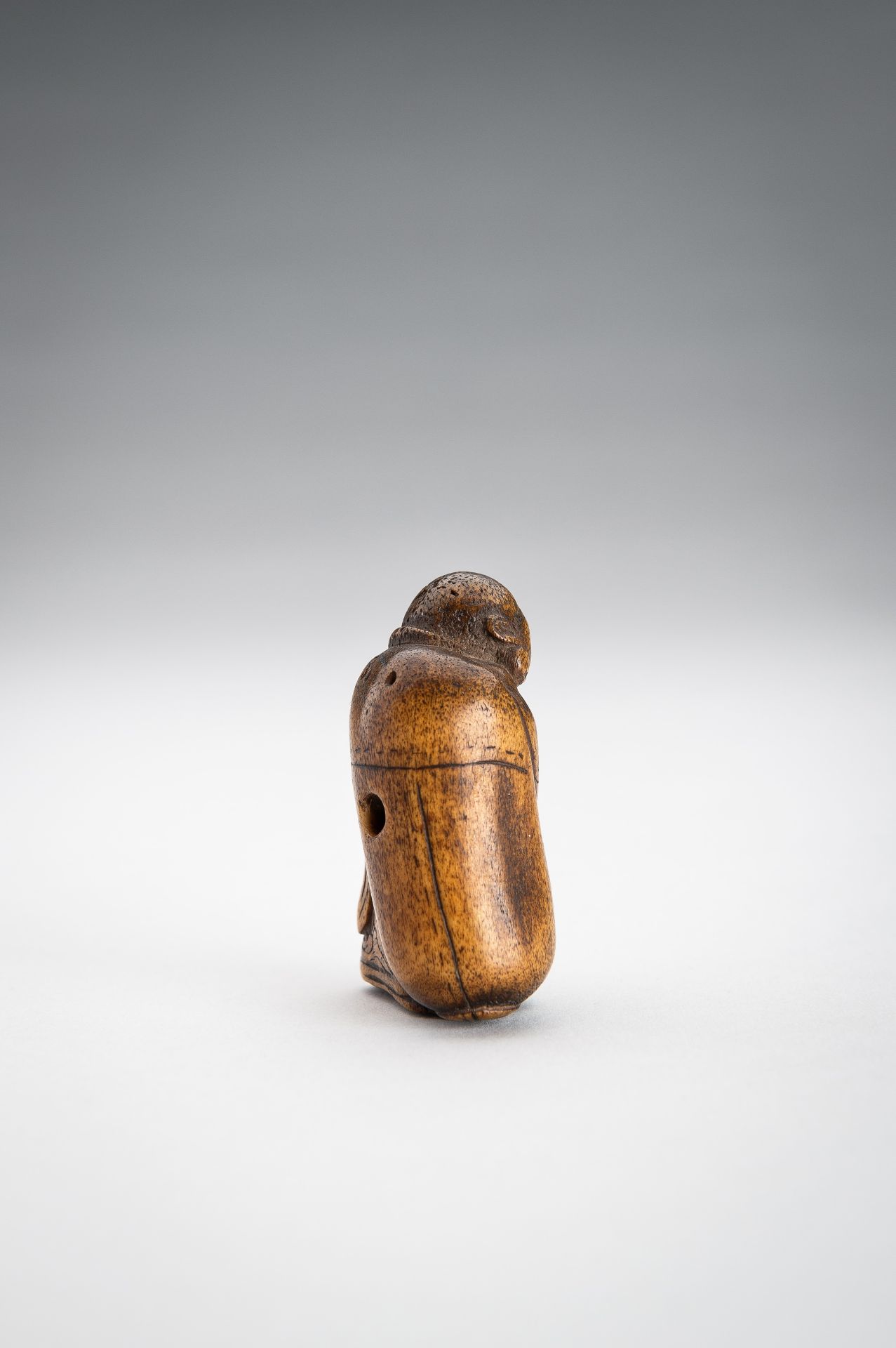 A STAG ANTLER NETSUKE OF HOTEI WITH HIS TREASURE BAG - Image 8 of 9