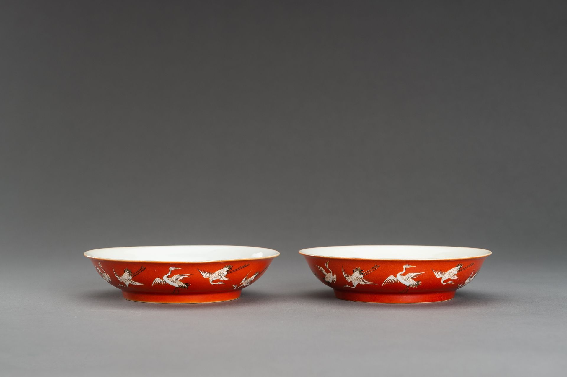 A PAIR OF RED GROUND 'BATS AND CRANES' SAUCER DISHES, GUANGXU MARK AND PROBABLY OF THE PERIOD - Image 6 of 13