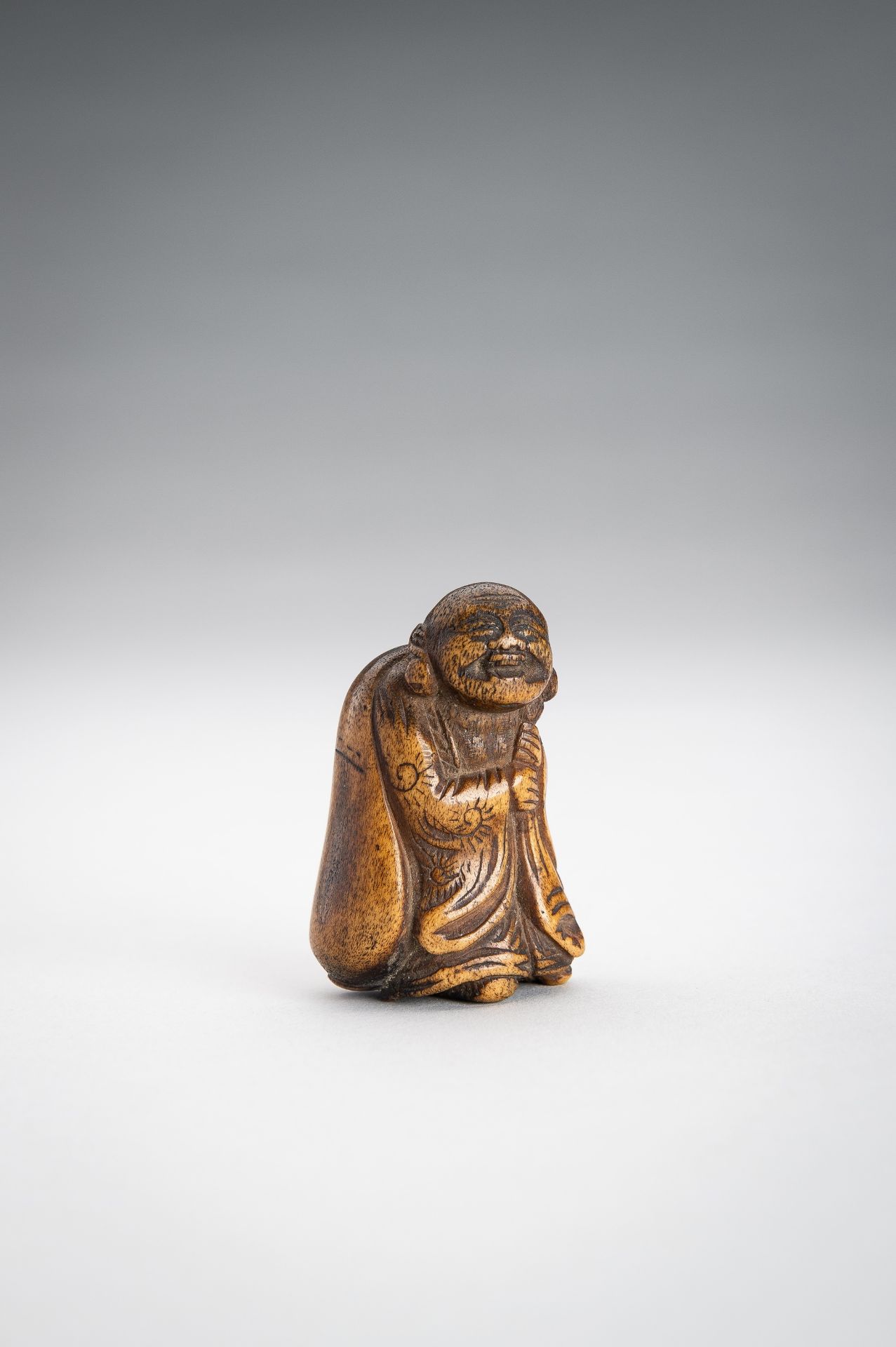 A STAG ANTLER NETSUKE OF HOTEI WITH HIS TREASURE BAG - Image 4 of 9