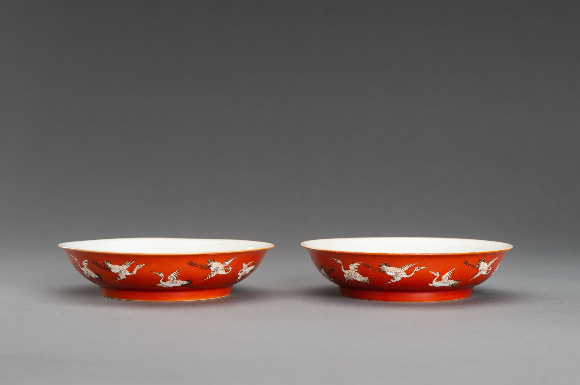 A PAIR OF RED GROUND 'BATS AND CRANES' SAUCER DISHES, GUANGXU MARK AND PROBABLY OF THE PERIOD - Image 11 of 13