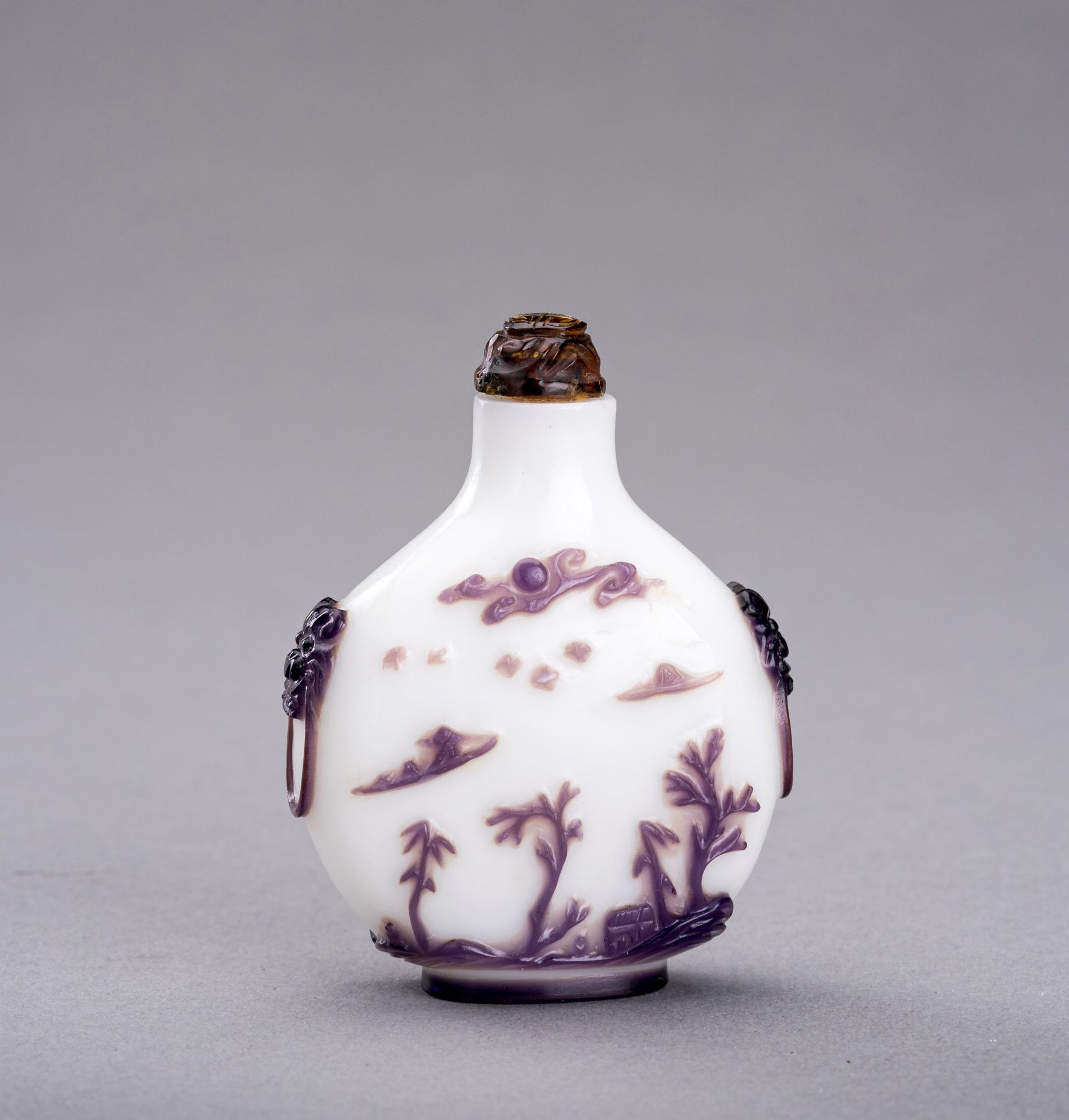 AN AUBERGINE OVERLAY GLASS SNUFF BOTTLE, QING DYNASTY