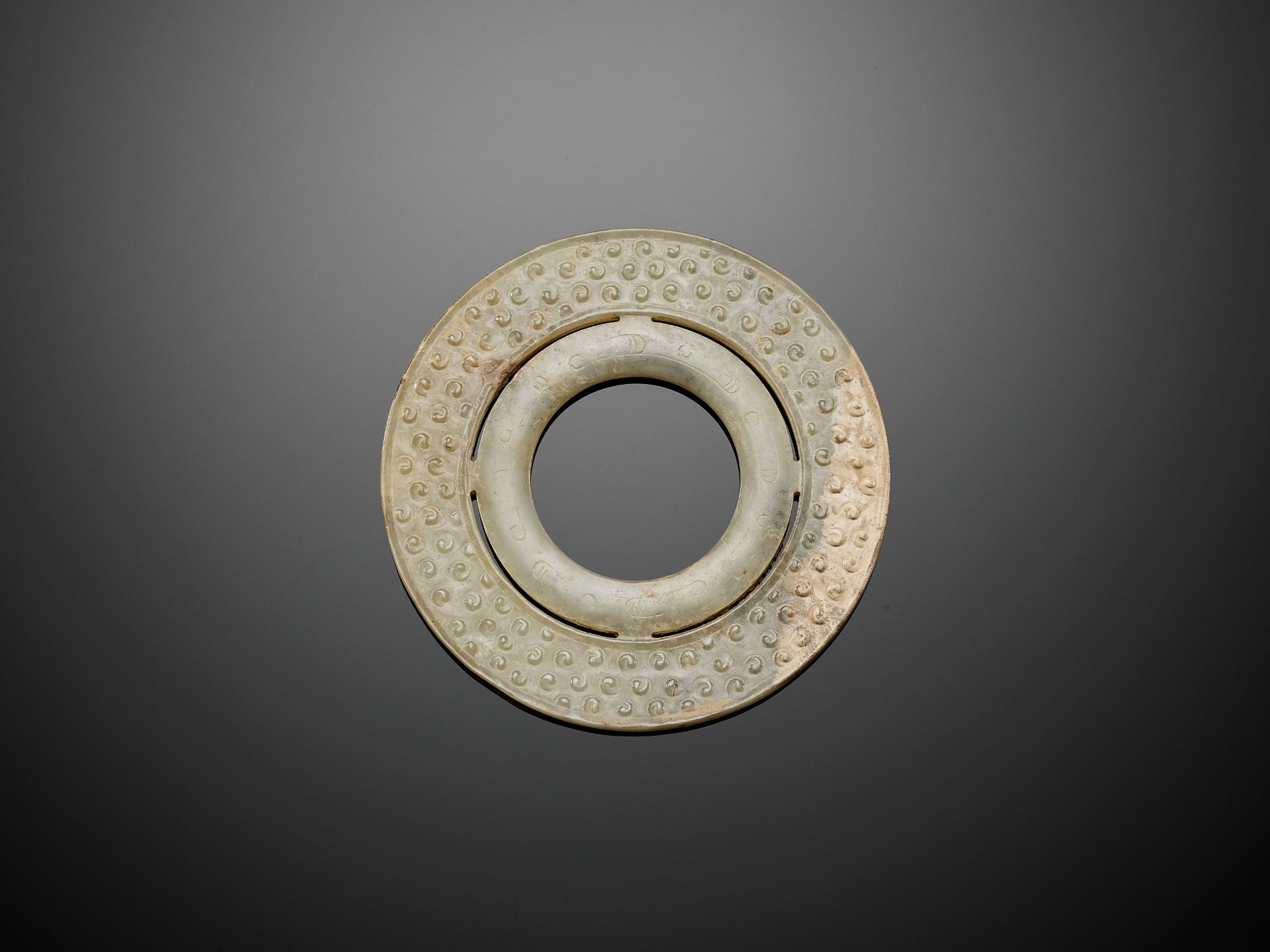 A JADE DOUBLE DISK, BI, WARRING STATES TO WESTERN HAN DYNASTY