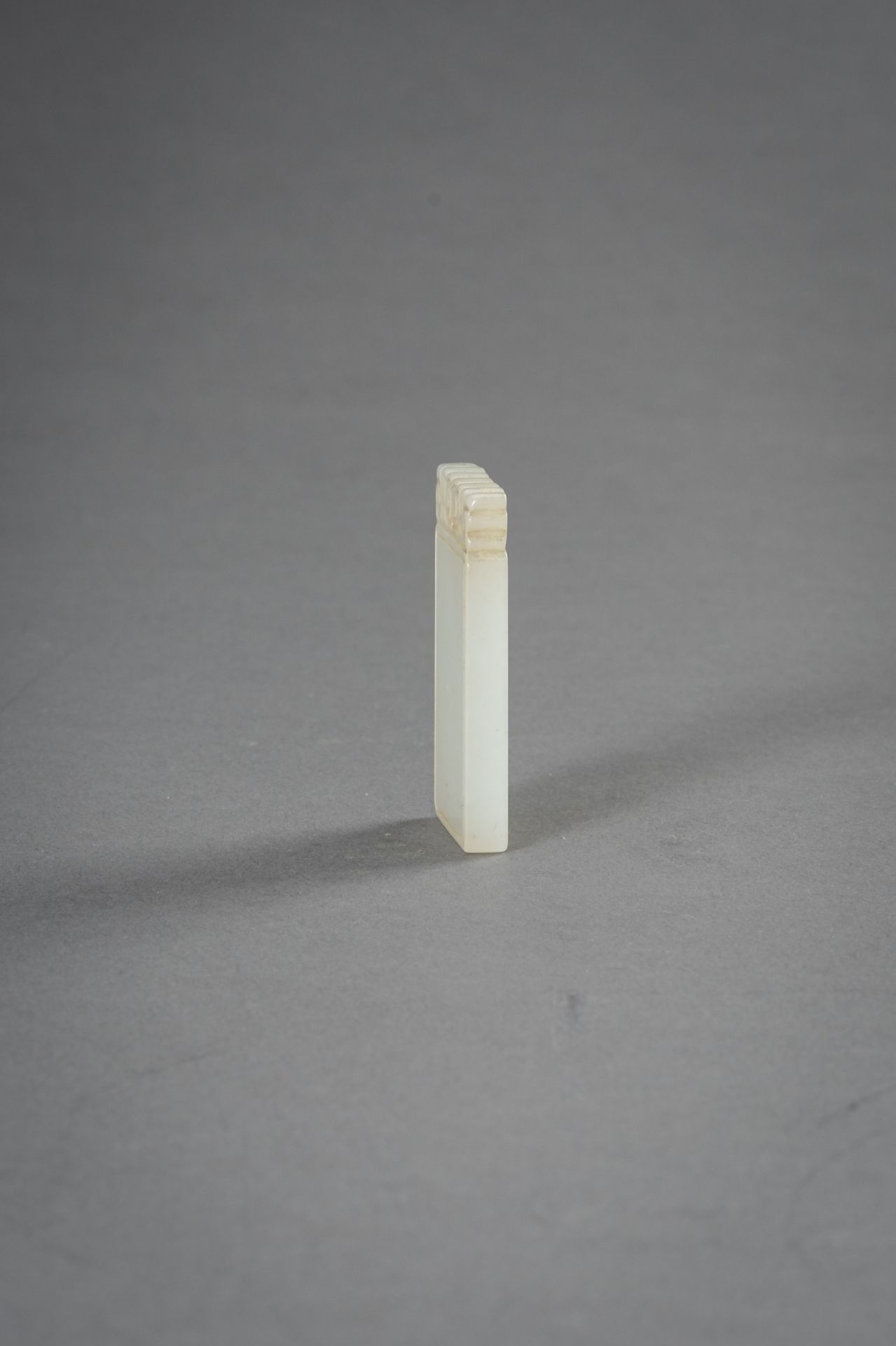 A MINIATURE WHITE JADE PLAQUE, 1930s - Image 2 of 8