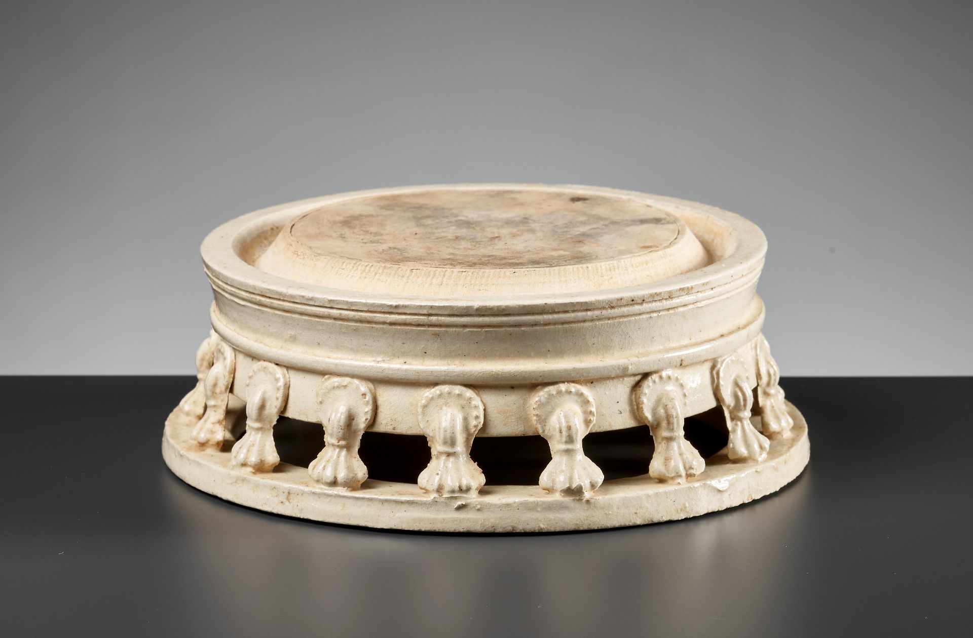 A RARE WHITE-GLAZED CIRCULAR INKSTONE, TANG REVIVAL