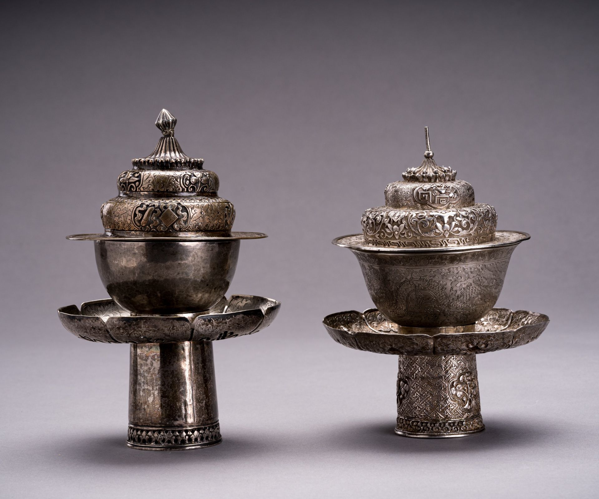 TWO SILVER BUTTER TEA SETS, QING DYNASTY
