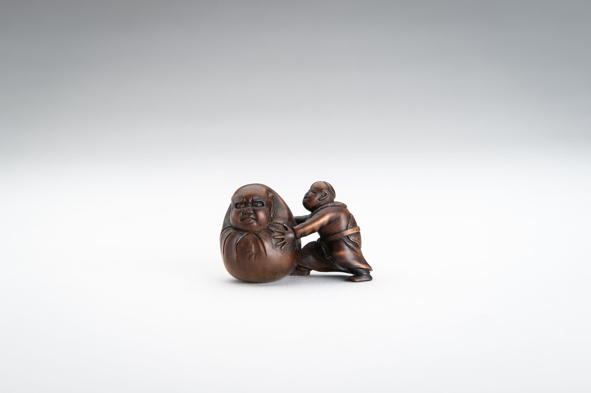 A WOOD NETSUKE OF A BOY WITH YUKI DARUMA (SNOWBALL) - Image 2 of 10