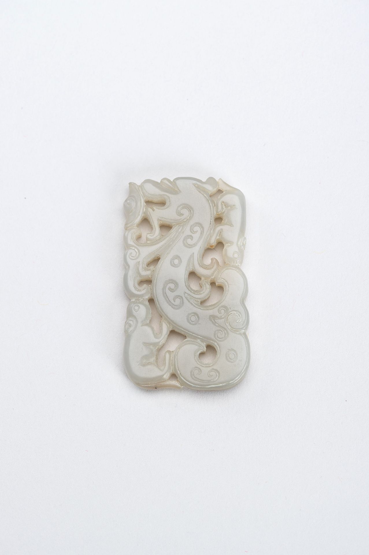 A CELADON-WHITE JADE 'DRAGON AND TAPIR' PENDANT, QING DYNASTY - Image 2 of 7