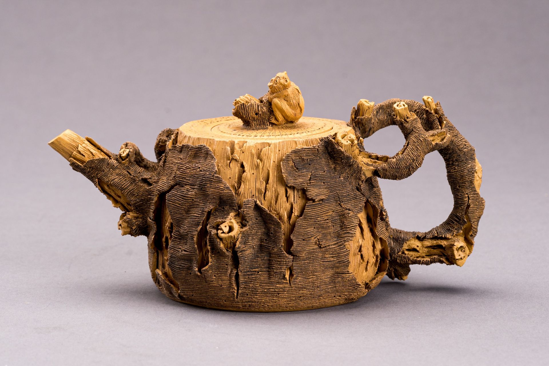 AN YIXING ZISHA 'TREE STUMP' TEA POT